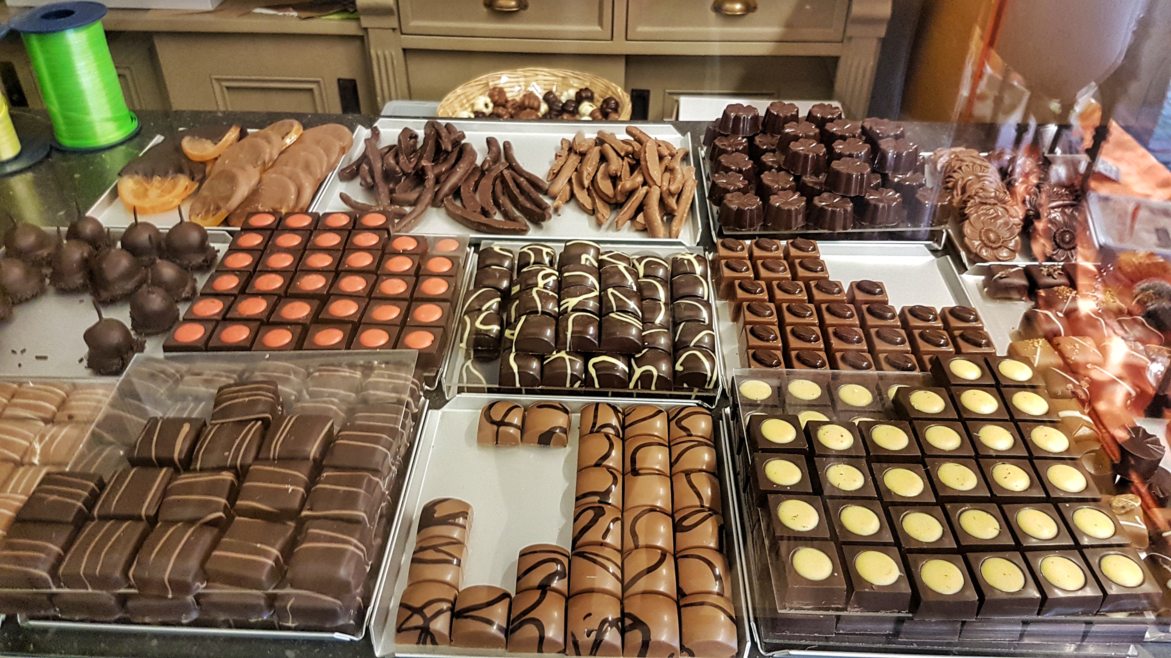 An array of Belgian chocolates in a traditional chocolate shop in Leuven, read more about what you can do in Leuven in 48 hours at www.whatsupcourtney.com #Leuven #travel #travelguide