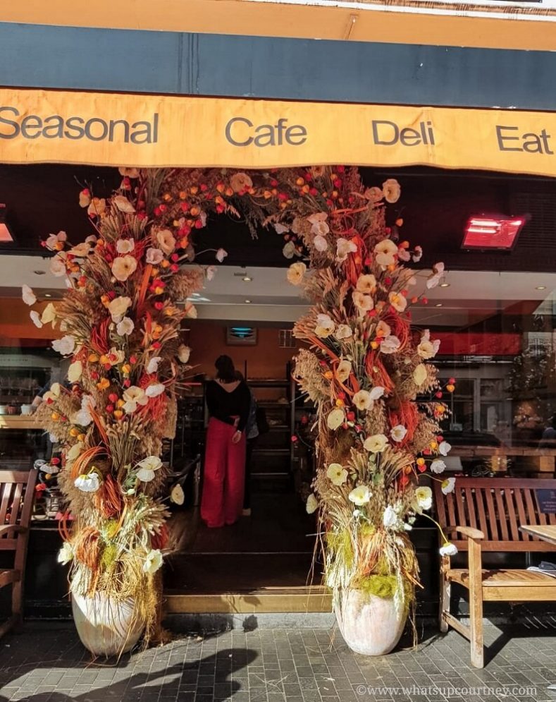 Floral arrangements outside the entrance of a cafe on Elizabeth St in Belgravia London Guide ->www.whatsupcourtney.com #London #belgravia #londonguide #travel #travelguide