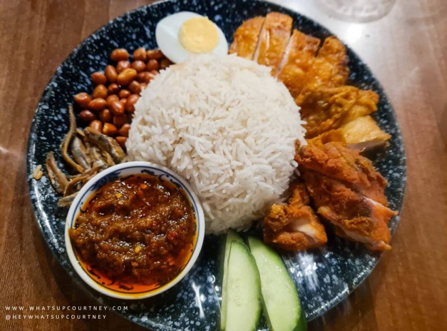 A Malaysian dish called nasi lemak consisting of fried chicken, nuts, cucumber, boiled egg, ikan bilis and fatty rice from a malaysian restaurant Chilli Padi in Newcastle Upon Tyne