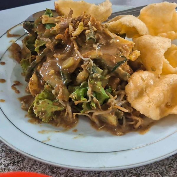 Traditional Indonesian Gado-Gado salad with peanut sauce, tofu, vegetables and boiled egg served fresh