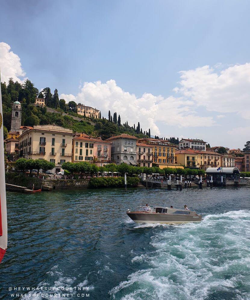 A view of the beautiful village of Varenna colourful buildings in Lake Como from the ferry