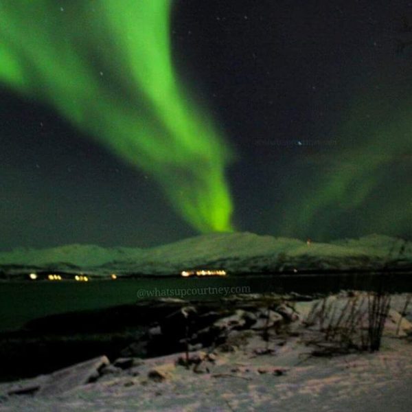Northern lights by the water in Tromso Norway
