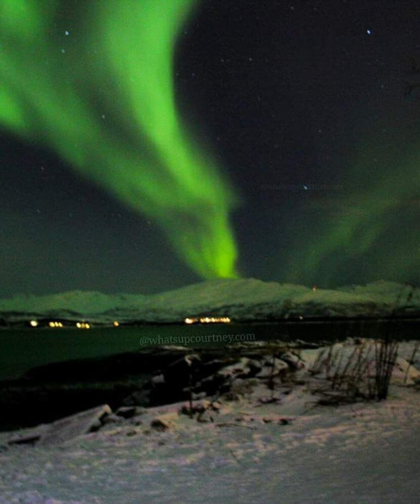 Northern lights by the water in Tromso Norway