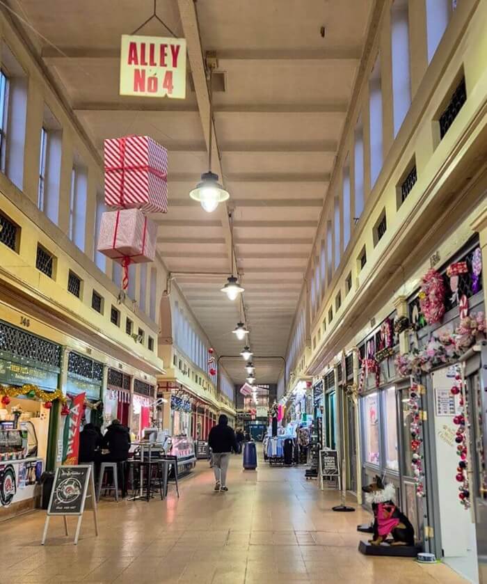One of the Alley ways in Grainger Market with Slice pizza on the left and Robinsons Pet shop on the right