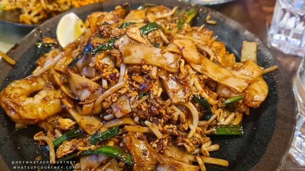 plate of delicious Char Kway Teow, stir fire flat rice noodles with veg, egg, and chicken and fishballs from Chilli Padi Newcastle whatsupcourtney