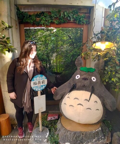 Courtney from whatsupcourtney.com posing with Totoro at Ghibli shop in Kyoto Japan