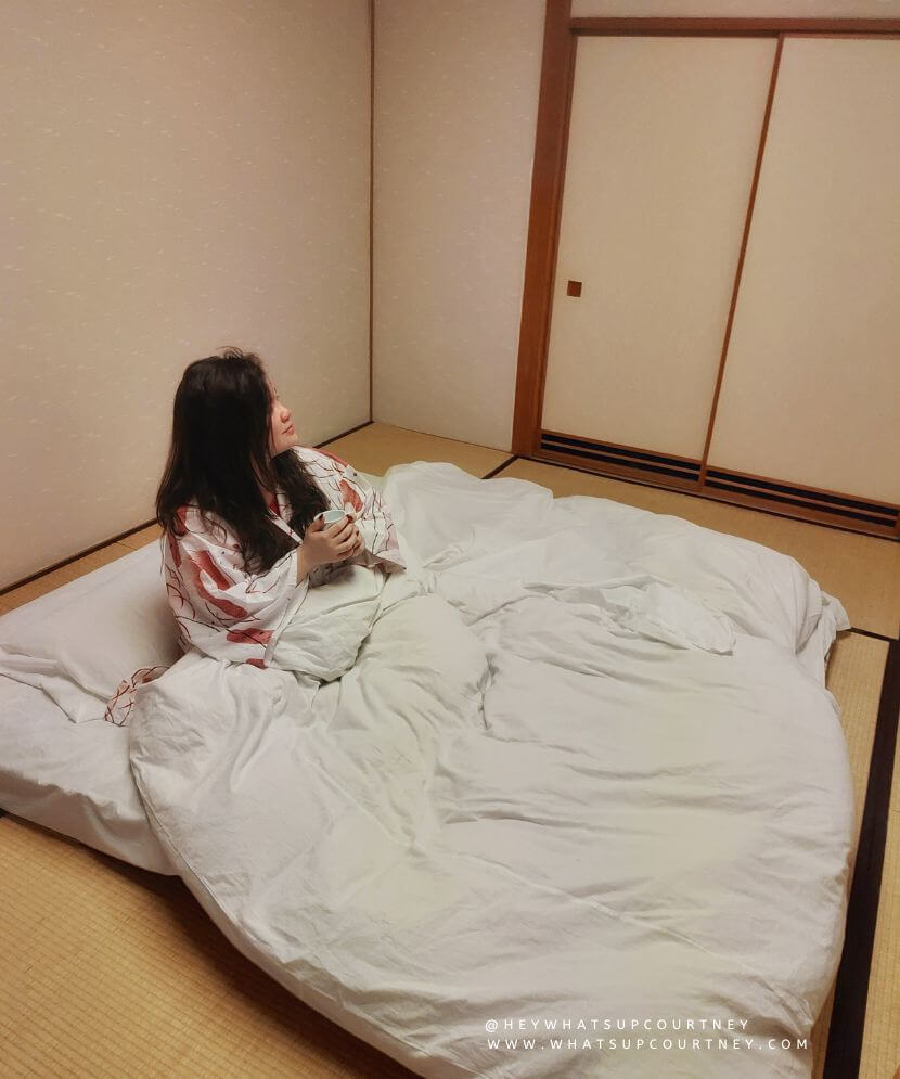 Courtney in futon in a ryokan Hakone