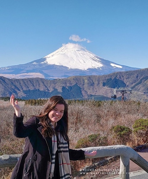 Courtney posing in from of Mount Fuji on a clear day in Hakone Japan