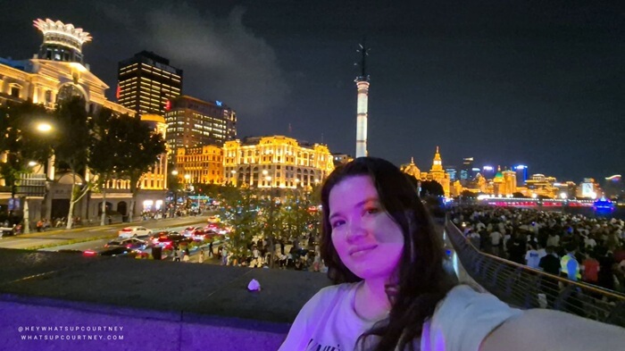 Courtney at a viewpoint overlooking The Bund in Shanghai at night at midautumn festival