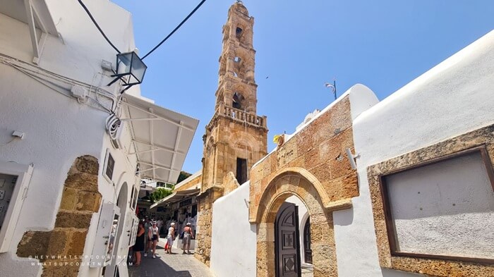 Lindos town in Rhodes Greece with white walls and tower