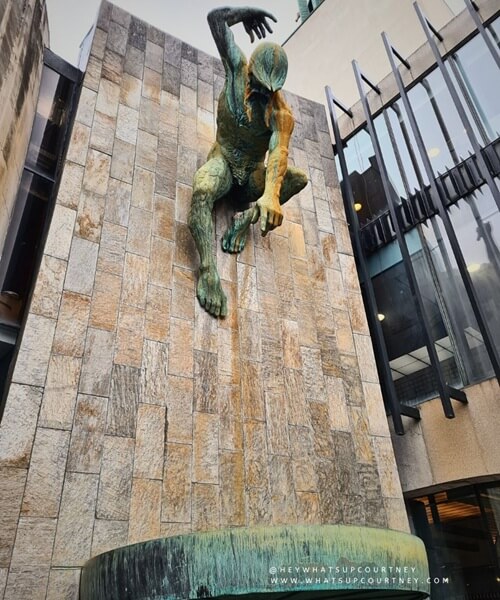 The statue of the Tyne God on a wall at the civic centre in newcastle city centre haymarket