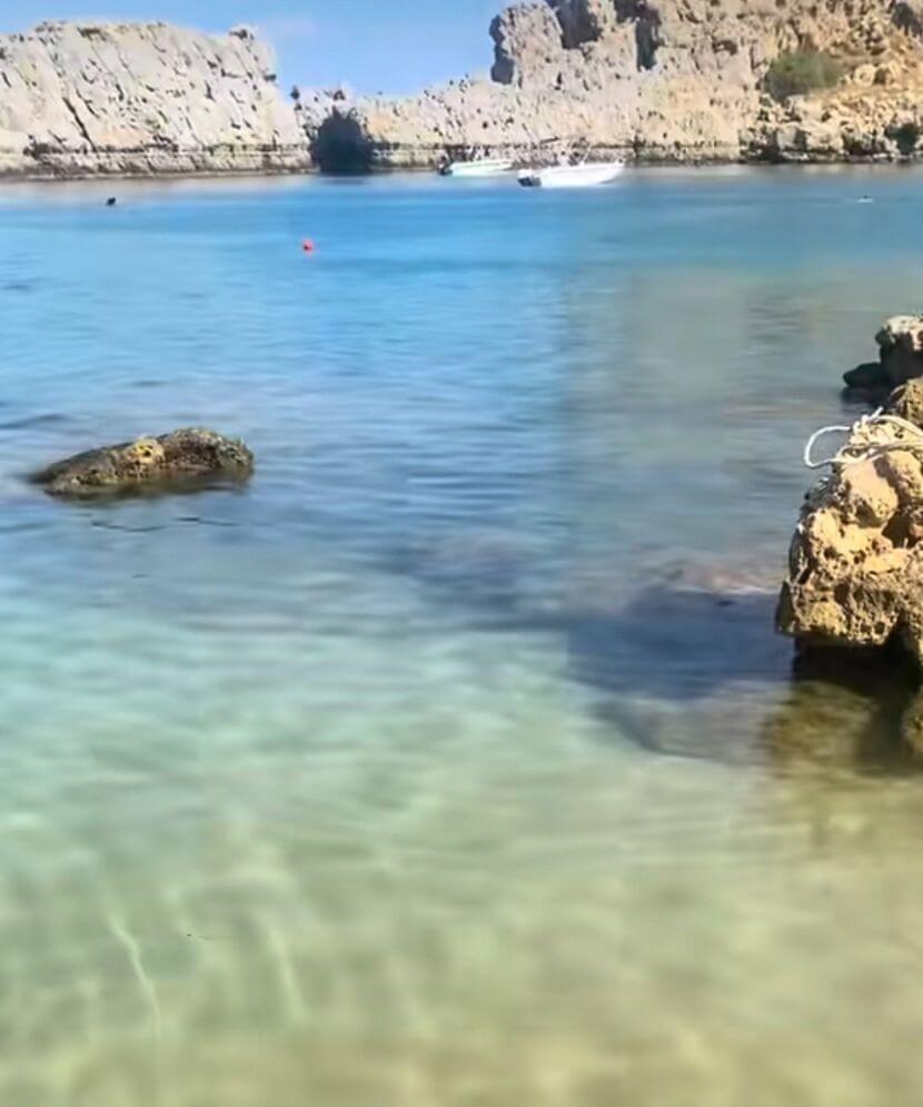 sea water and beach side of St Pauls Bay in lindos rodos greece