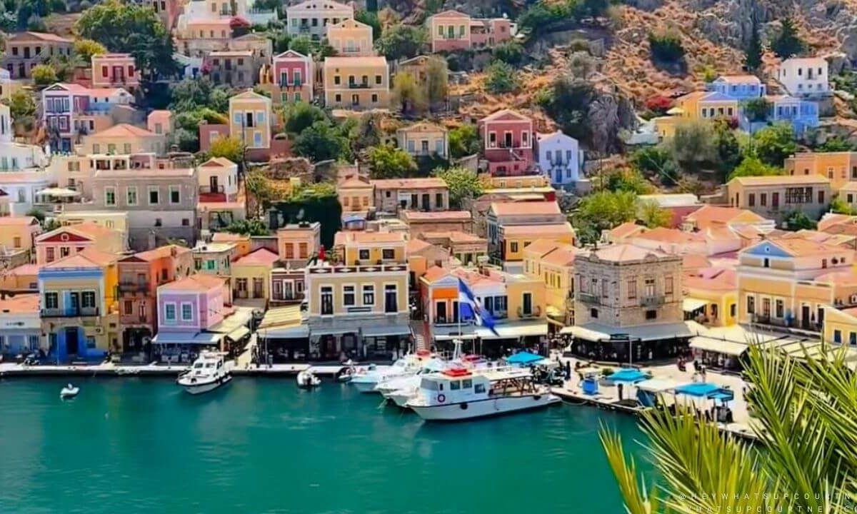 Symi harbour front with ferries and colourful houses