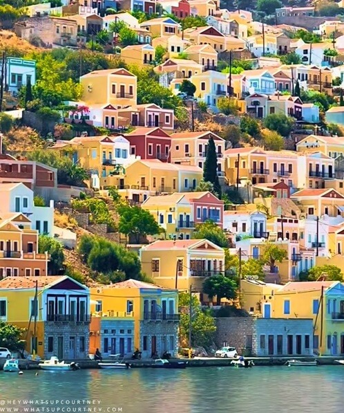 colourful houses on the harbourfront from symi rhodes greece